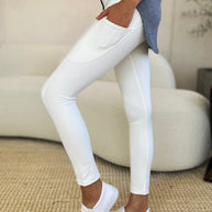 Wide waistband sports leggings in white, stretchy and opaque, featuring nylon and spandex blend.