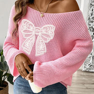 Pink long sleeve sweater with bow boat neck design and casual fit.