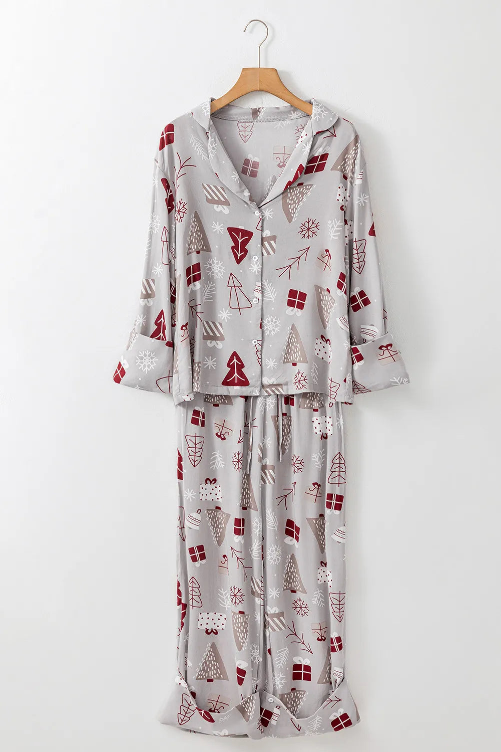 Printed long sleeve top and pants lounge set in gray with red and white holiday motifs.