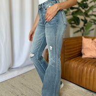 Judy Blue full size medium rise flare jeans with tummy control and distressed detailing.