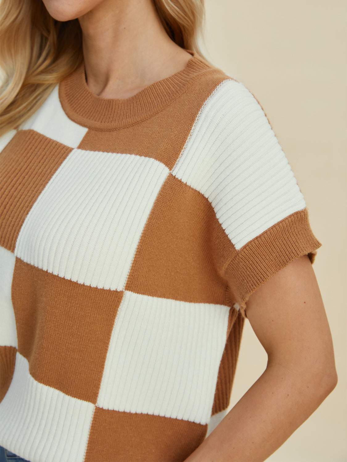 Full size checkered round neck short sleeve sweater in brown and white.