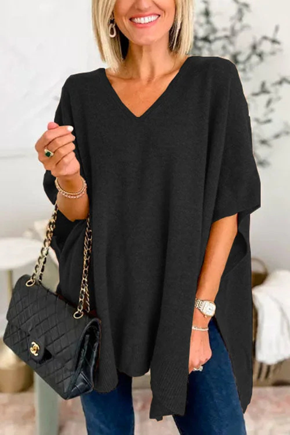 Slit V-Neck Half Sleeve Knit Top in black with slightly stretchy fabric.