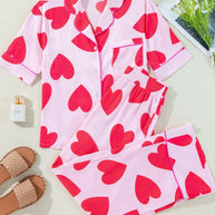 Heart Collared Neck Short Sleeve Top and Pants Lounge Set with red heart patterns on pink fabric.