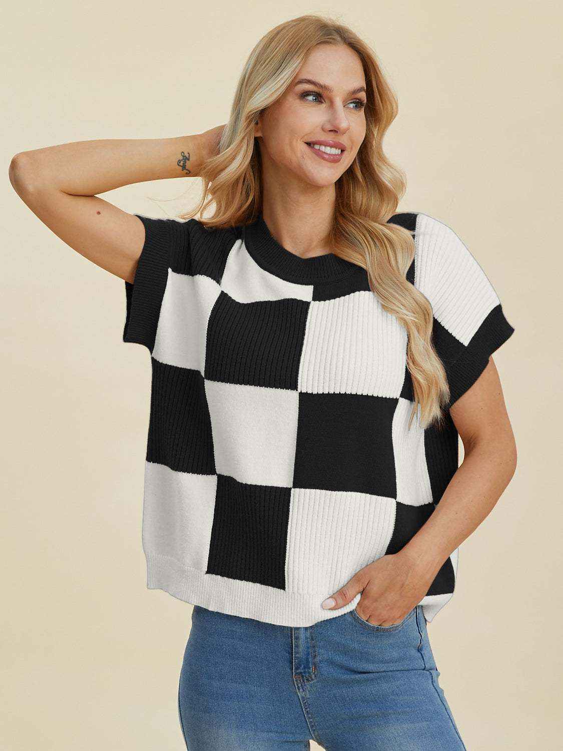 Full Size Checkered Round Neck Short Sleeve Sweater in black and white, worn by model.