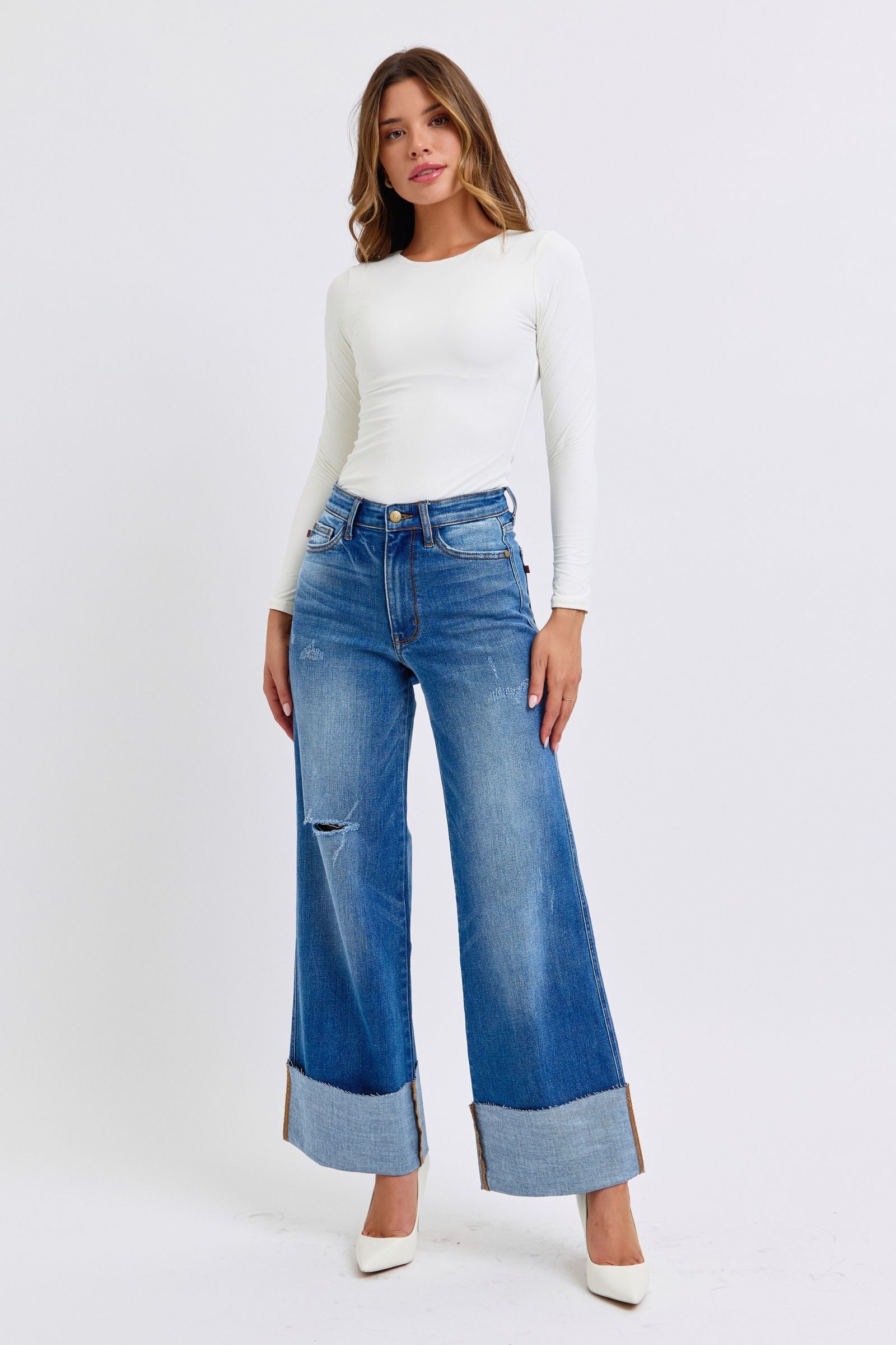 Judy Blue full size distressed high waist wide leg jeans on model.