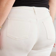 Woman wearing RFM Mini Mia Full Size Tummy Control High Waist Raw Hem Jeans in white.