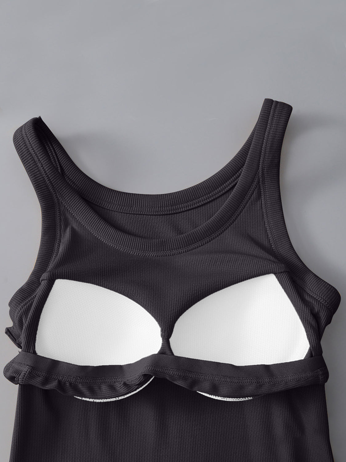 Round neck tank with bra in black, opaque, moderate stretch, viscose-spandex blend.