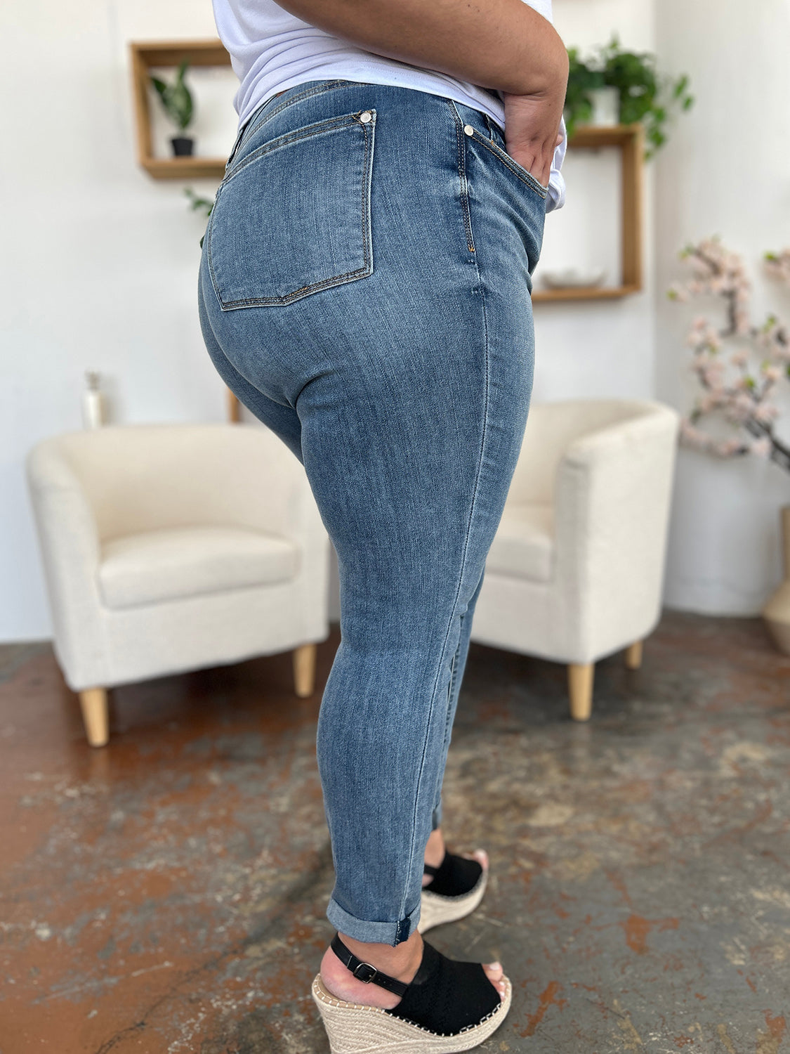 Judy Blue Full Size Cuffed Hem Slim Jeans modeled, showcasing a flattering fit with modern cuffed hem.