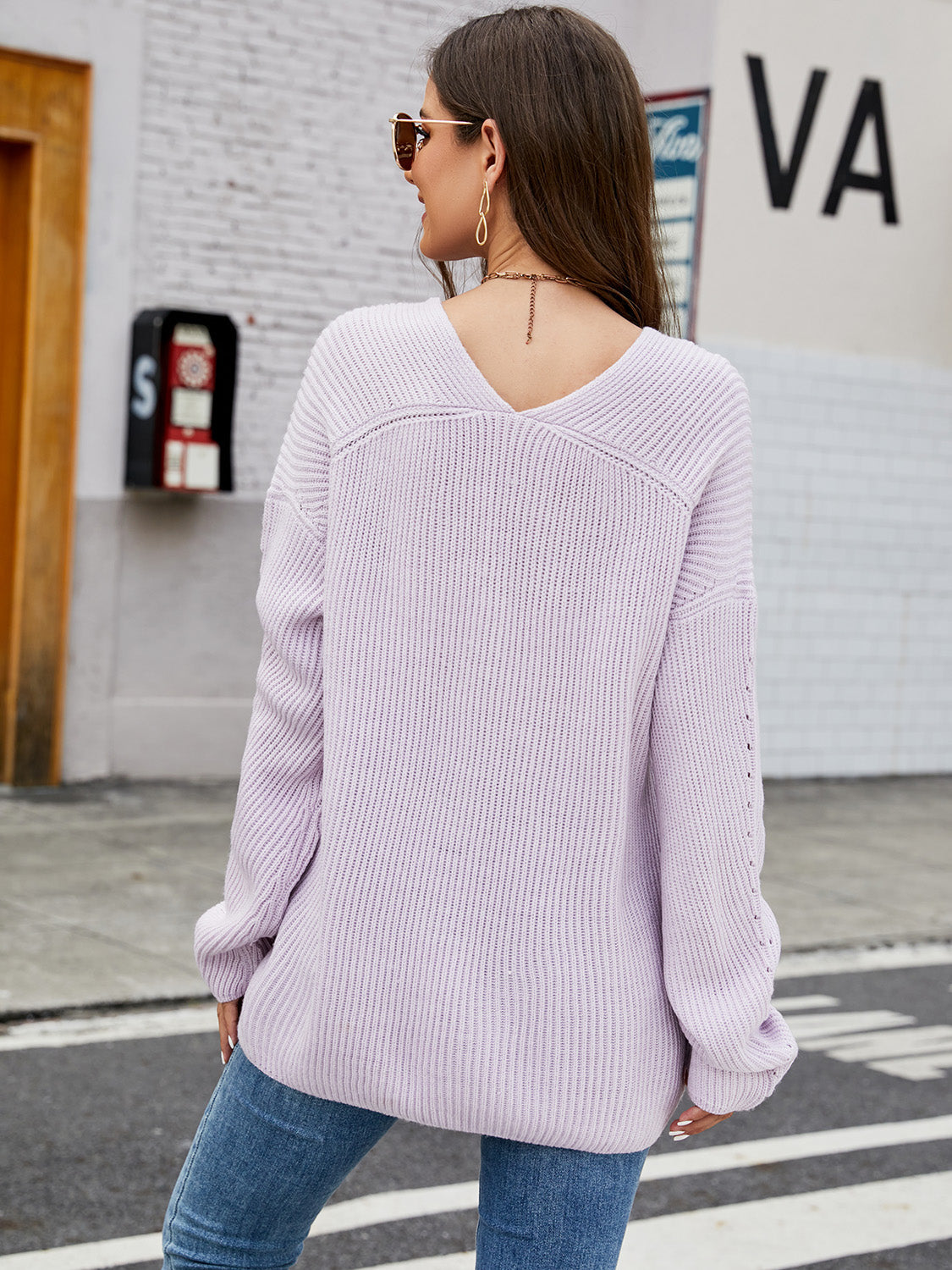 V-neck rib-knit top in lavender, slightly stretchy, acrylic material.