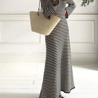 Devine Tied Round Neck Striped Sweater Dress with black and white stripes, long sleeves, and a relaxed fit.