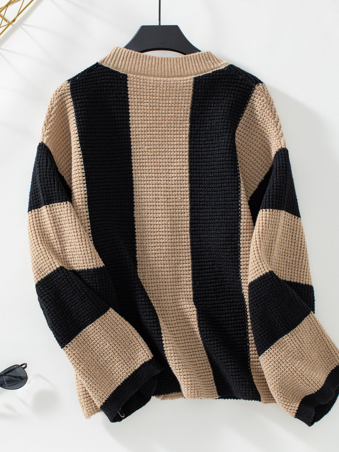 Waffle-knit V-neck striped long sleeve cardigan in black and beige.