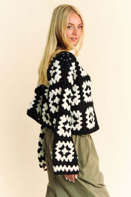 Two tone flower square crochet open front cardigan on model.