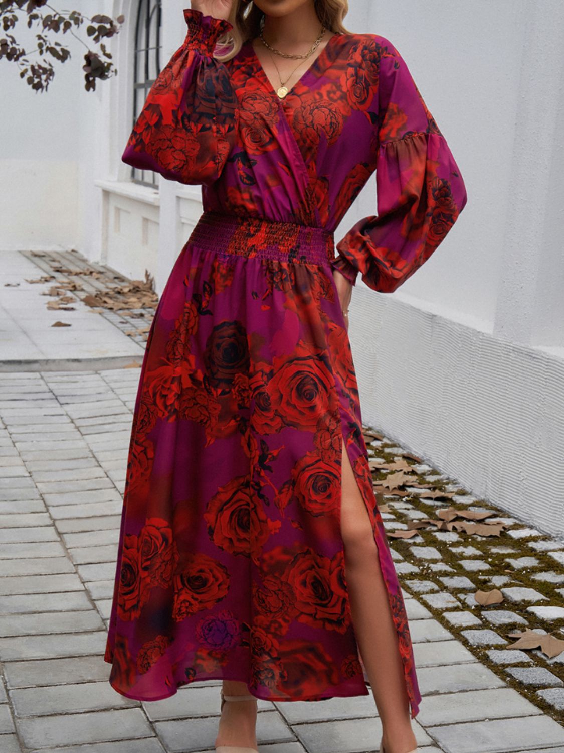 Split printed surplice long sleeve midi dress with smocked waist and floral design.