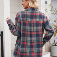 Woman wearing Mandy Plaid Button Up Long Sleeve Shirt in red and green checks, outdoors.