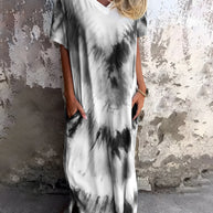 Full Size Pocketed Tie-Dye Short Sleeve Dress with black and white design.