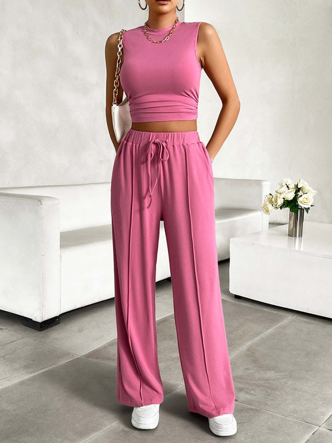 Devine Mock Neck Sleeveless Top and Drawstring Pants Set in pink, stretchy polyester blend, pocketed design.