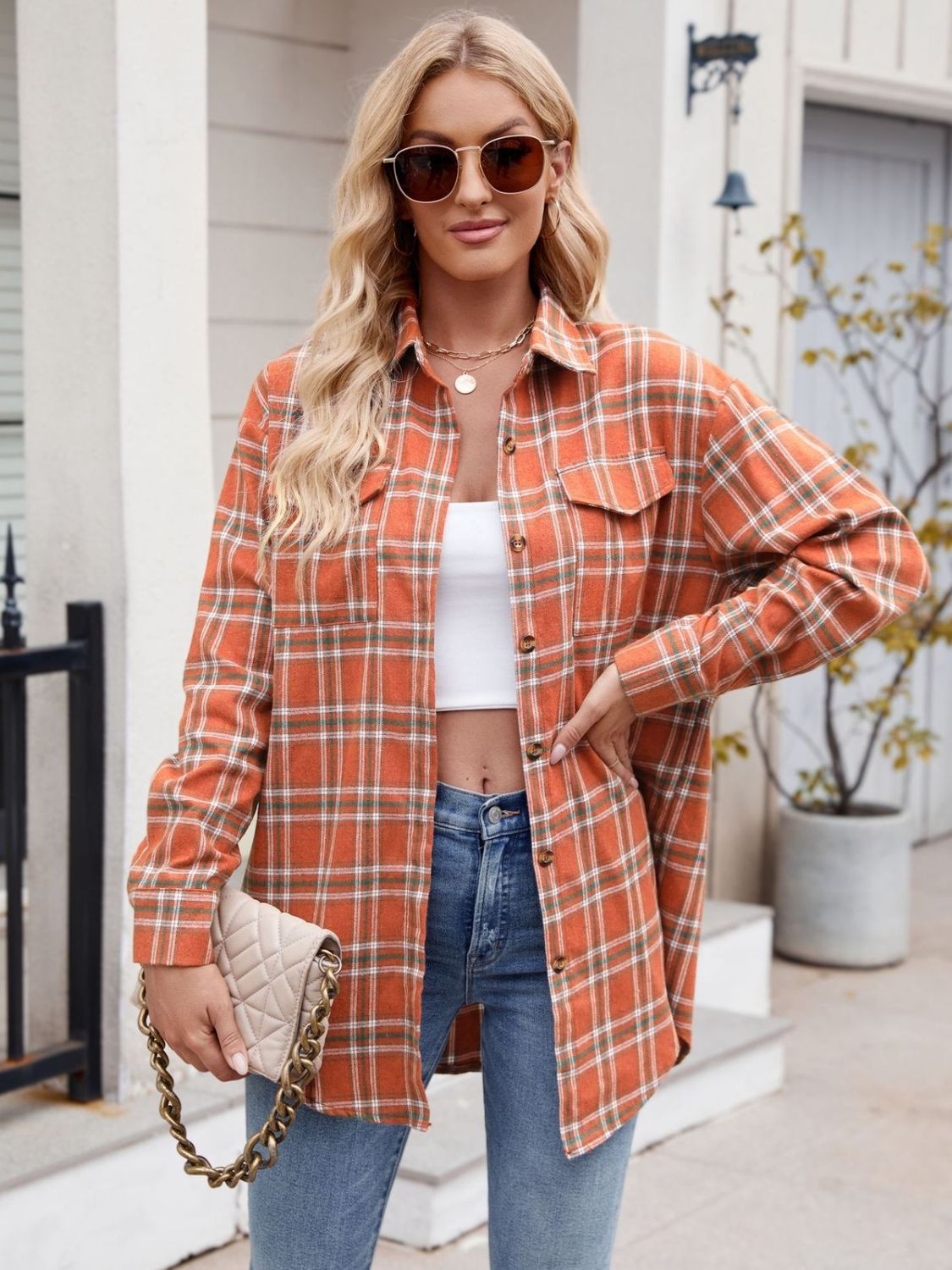 Mandy Plaid Button Up Long Sleeve Shirt with pocket, orange and white plaid design, worn by model.