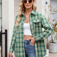 Green plaid button-up long sleeve shirt with pocket, worn casually with jeans.