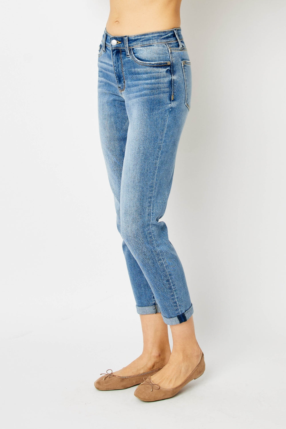 Judy Blue Full Size Cuffed Hem Slim Jeans showcasing a chic, modern look with cuffed hems, perfect for versatile styling with various tops and shoes.