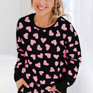 Heart Print Long Sleeve Top and Shorts Lounge Set with pink heart pattern on black fabric.