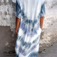 Full size pocketed tie-dye short sleeve dress in white and blue, featuring a slightly stretchy, opaque material.