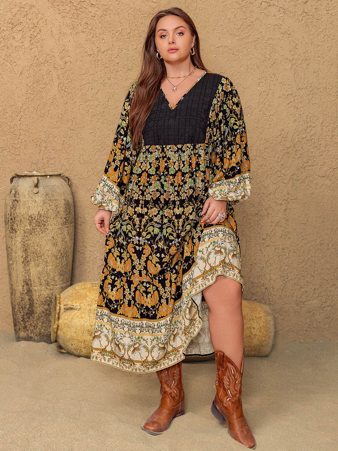 Plus size floral V-neck balloon sleeve midi dress in black and yellow pattern.