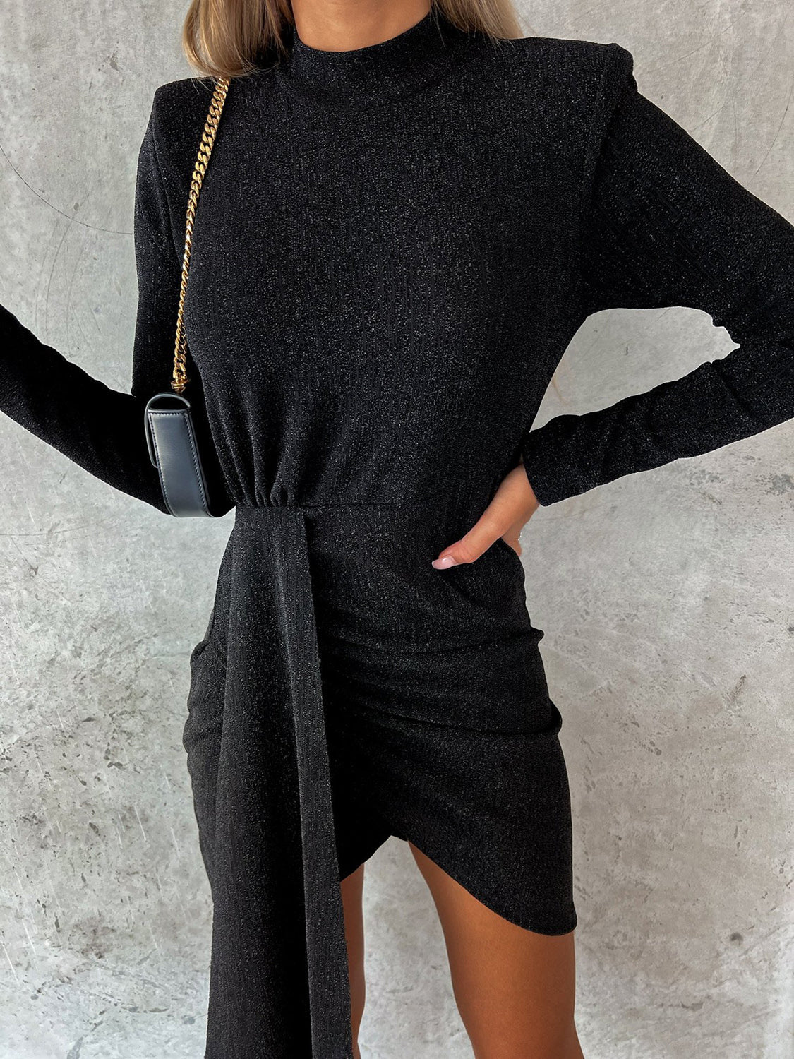 Heathered mock neck long sleeve mini dress in black.