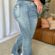 Judy Blue full size medium rise tummy control destroy flare jeans with distressed detailing.