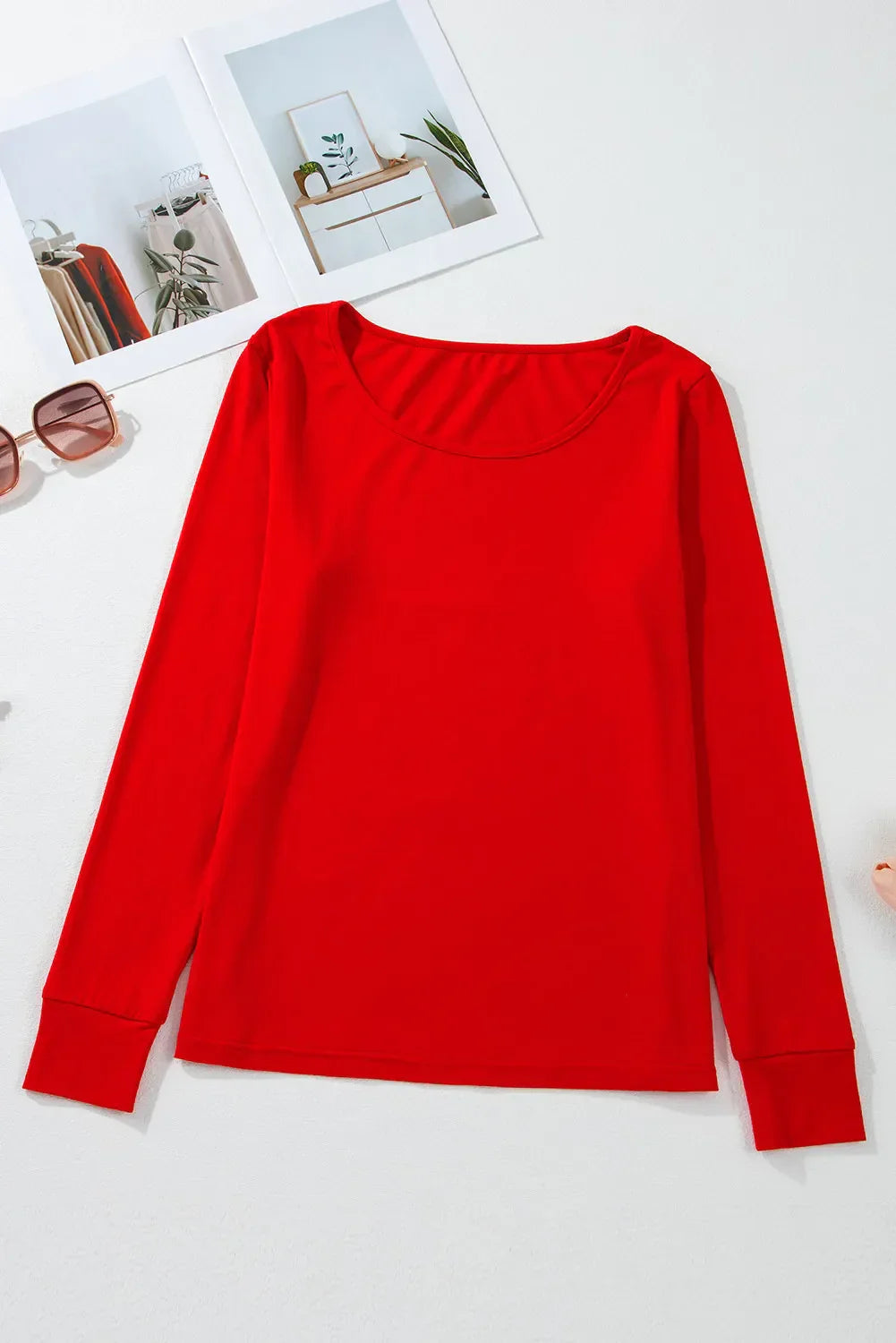 Round neck red long sleeve top fabric display.