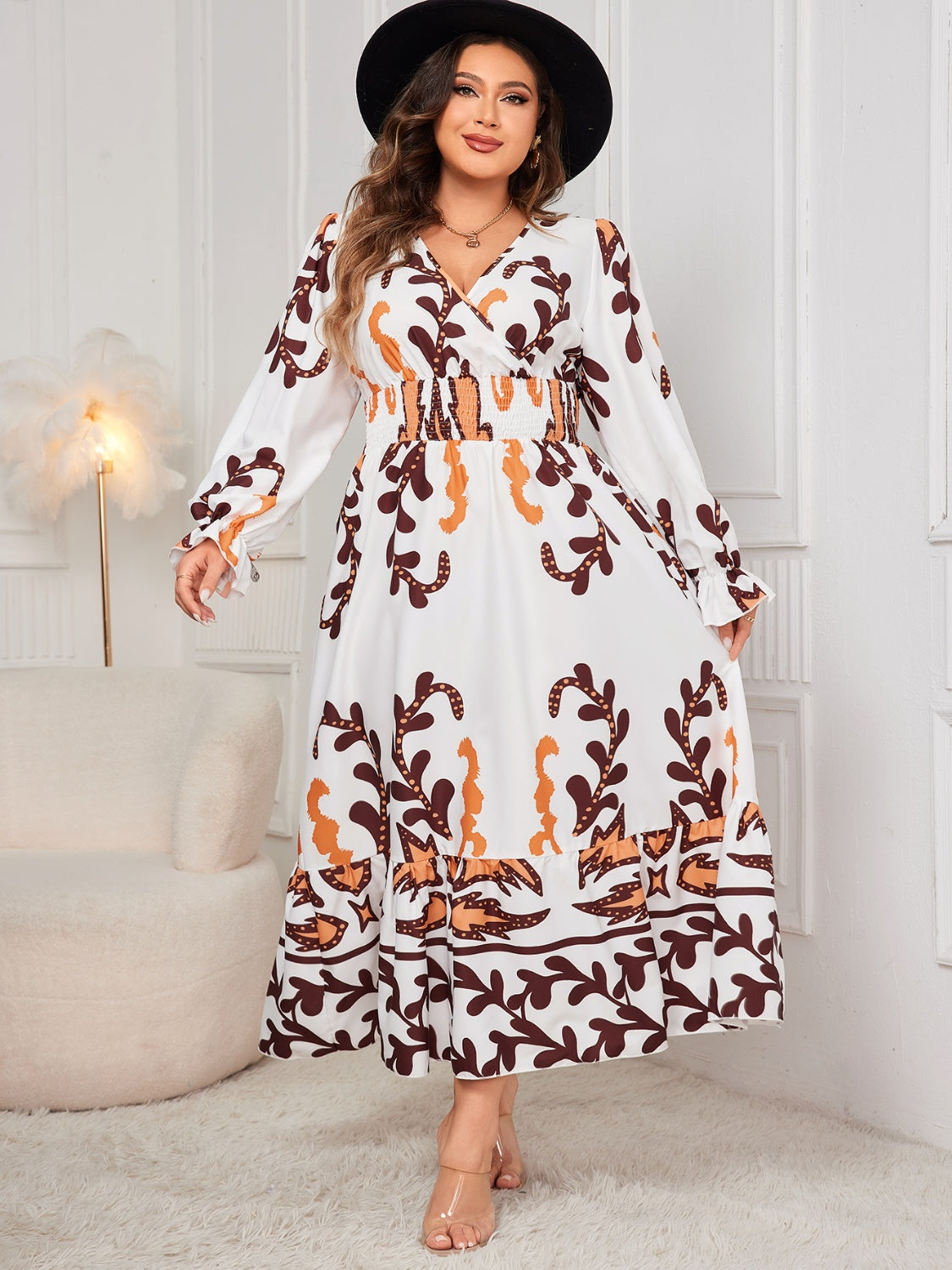 Plus size printed surplice flounce sleeve dress with ruffled design.