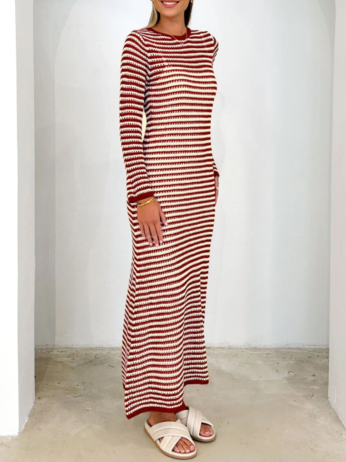 Devine Tied Round Neck Striped Sweater Dress in red and white, full-length with moderate stretch.