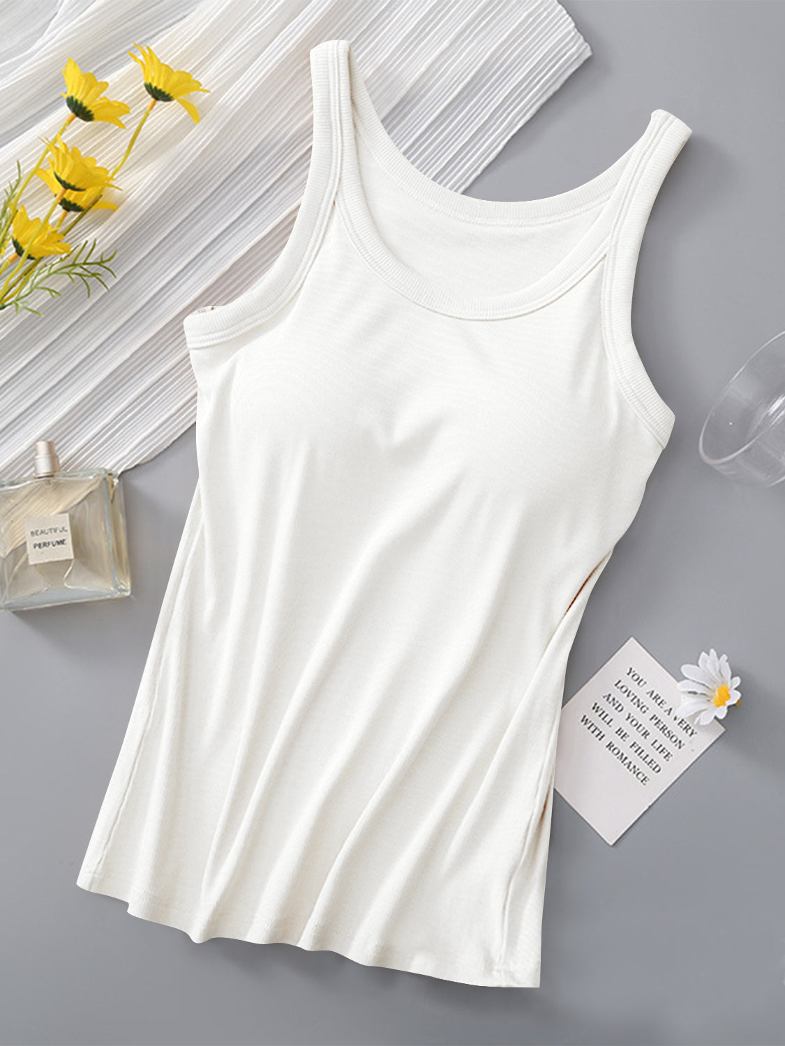 Round neck tank with built-in bra, white, viscose-spandex blend.