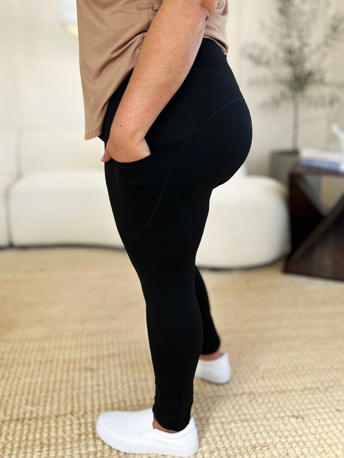 Wide waistband sports leggings in black, stretchy and opaque, suitable for athletic activities.