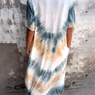 Full size tie-dye short sleeve dress with pockets, featuring blue and tan pattern.