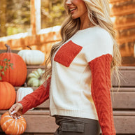 Color block round neck long sleeve sweater with pocketed design and slightly stretchy fabric.