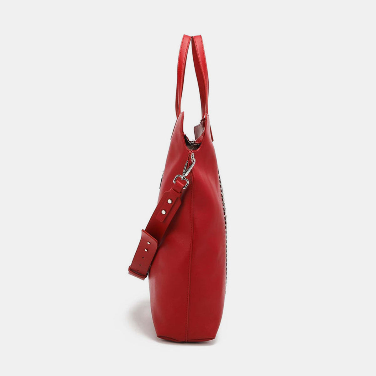 Nicole Lee USA studded large tote bag in red vegan leather with side view showing optional shoulder strap and studded detailing.