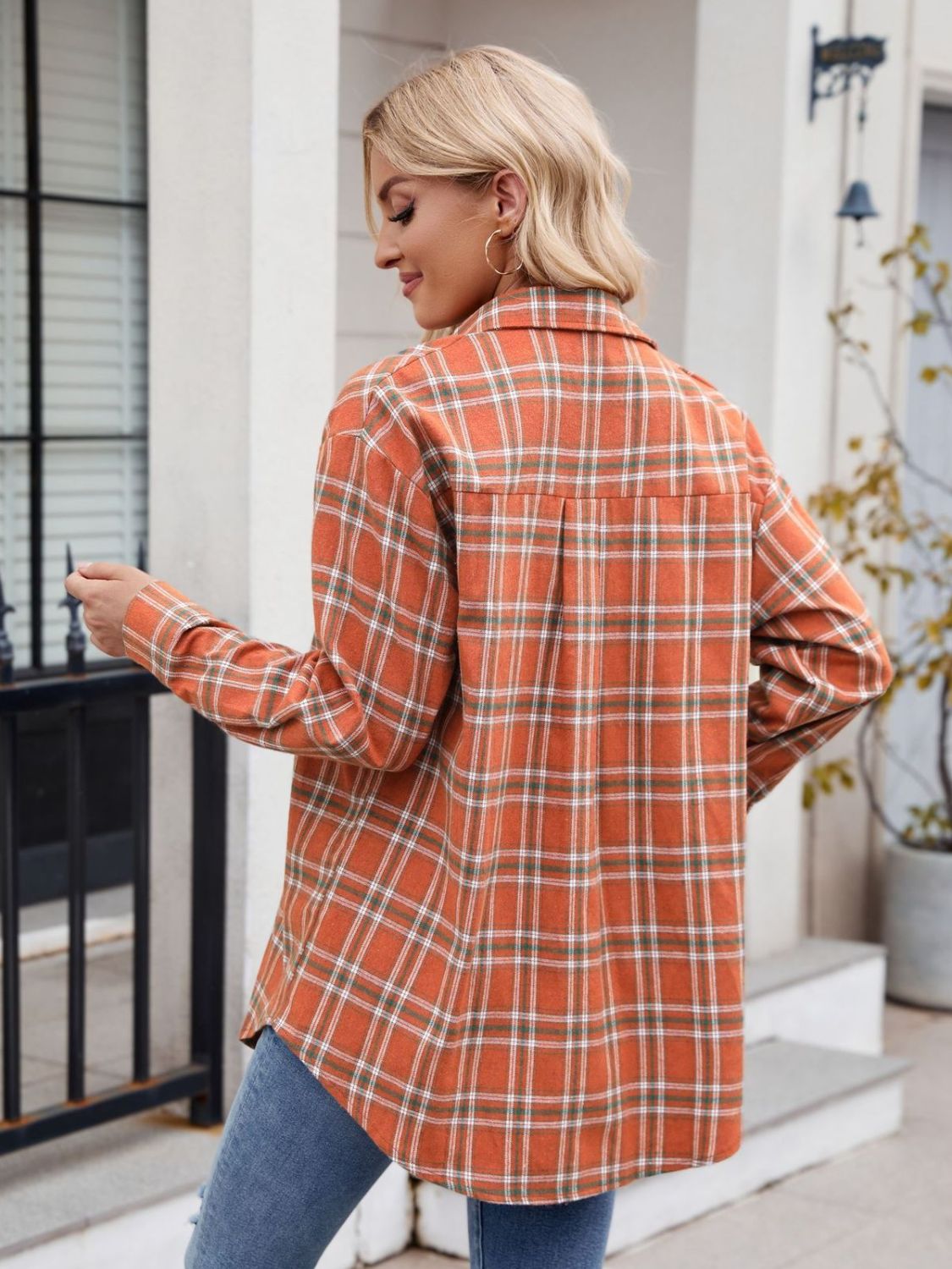 Orange plaid button-up long-sleeve shirt with pockets.