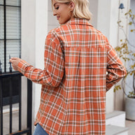 Orange plaid button-up long-sleeve shirt with pockets.