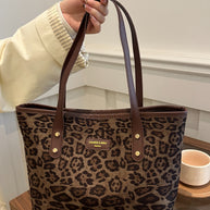 Leopard polyester tote bag, large size, imported, with brown handles.