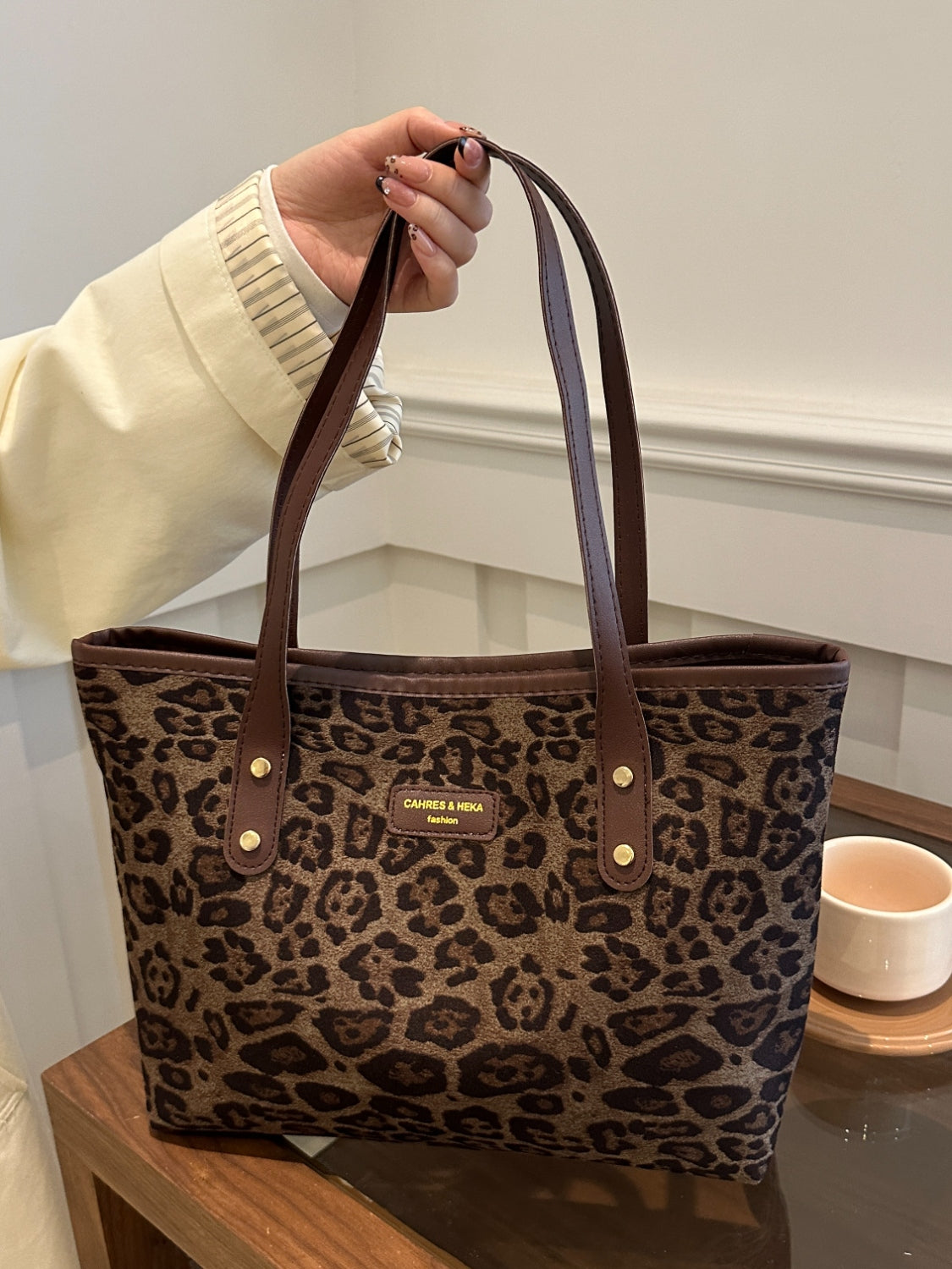 Leopard polyester tote bag, large size, imported, with brown handles.