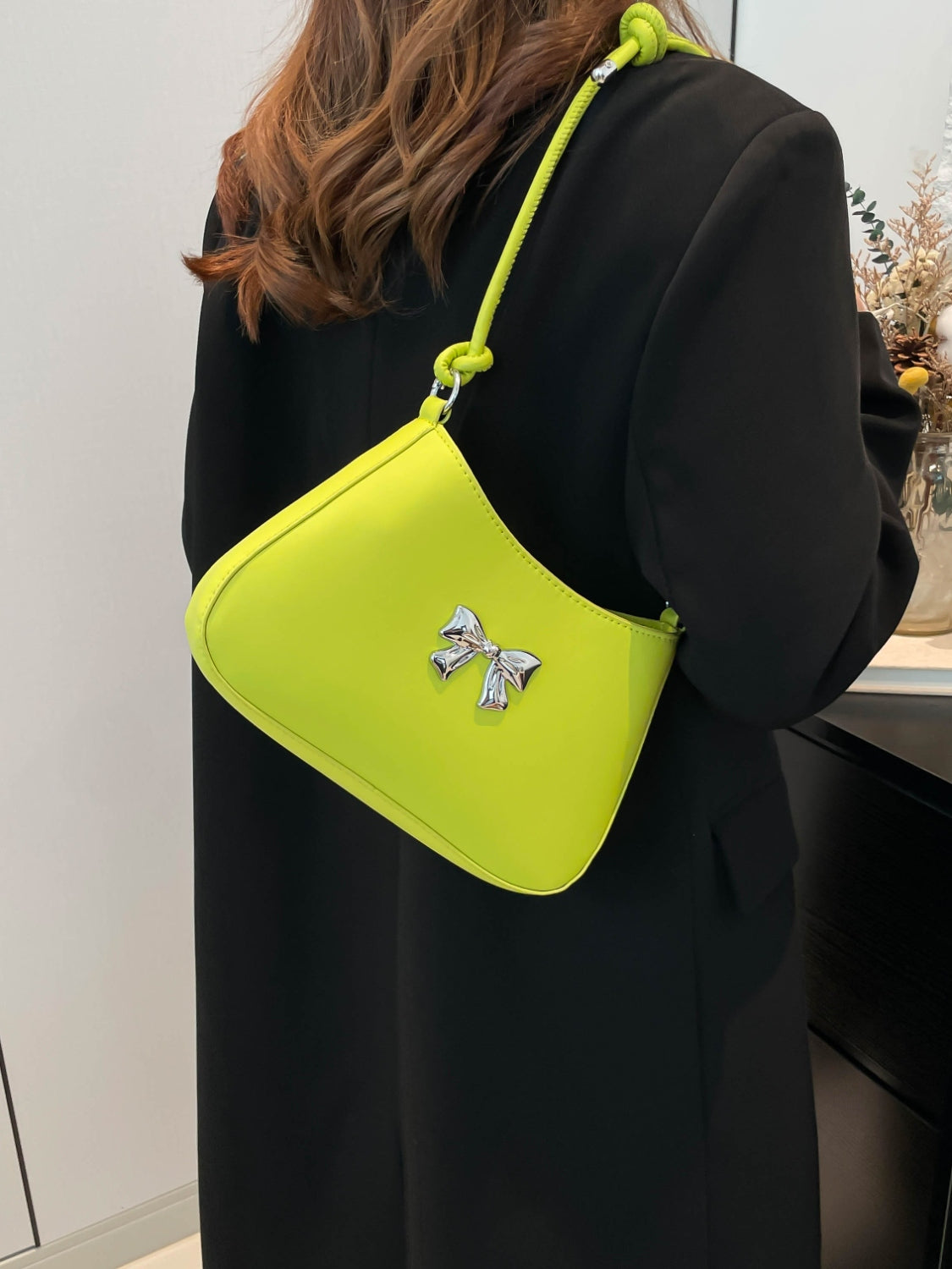 Small bow PU leather knotted strap handbag in lime green.