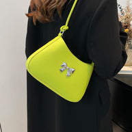 Small bow PU leather knotted strap handbag in lime green.