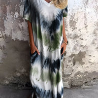 Full size pocketed tie-dye short sleeve dress with a slightly stretchy, opaque fabric blend of polyester and spandex.