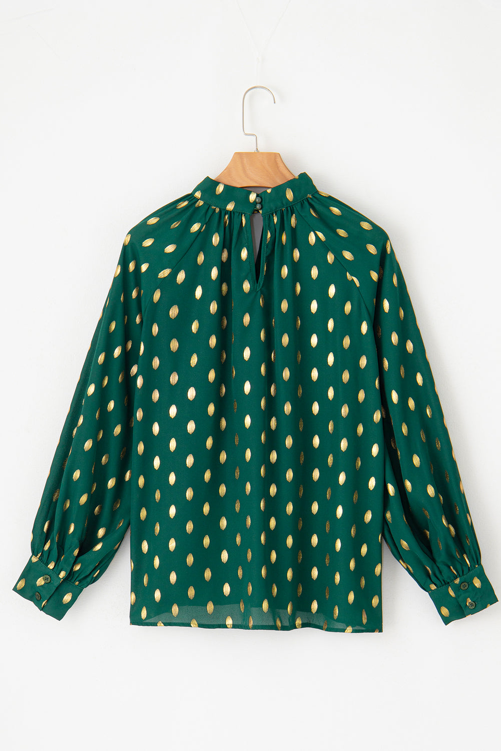 Cutout printed mock neck long sleeve blouse, green with gold pattern.