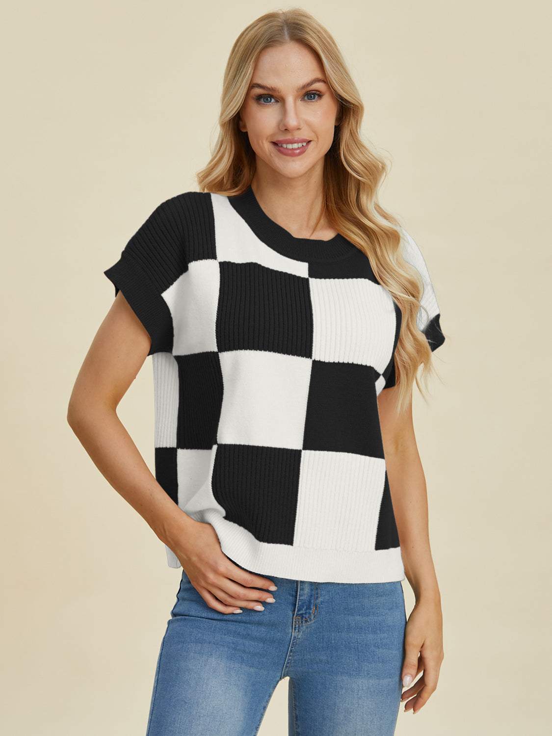 Full size checkered round neck short sleeve sweater in black and white.