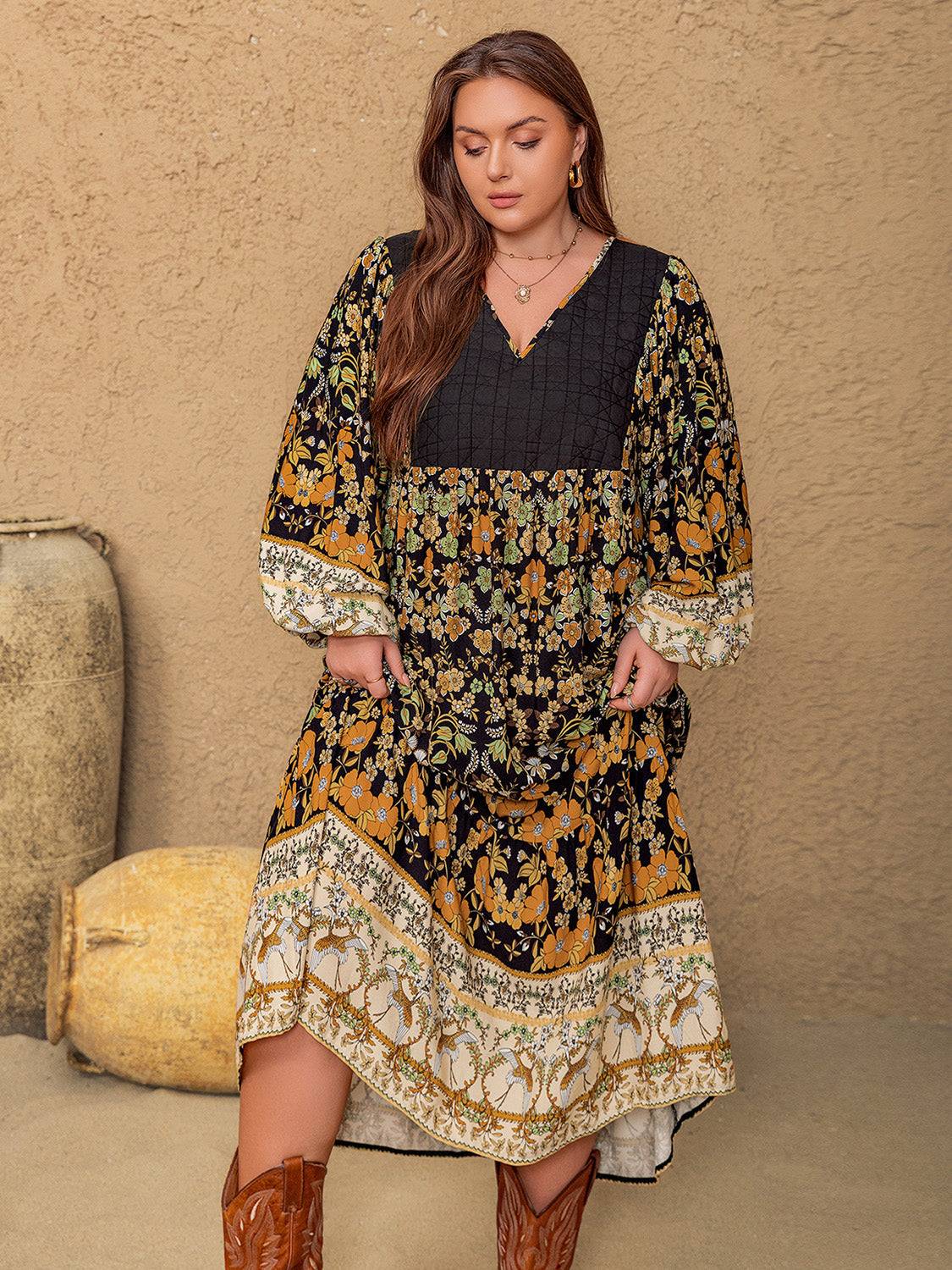 Plus size floral V-neck balloon sleeve midi dress in black and mustard tones.