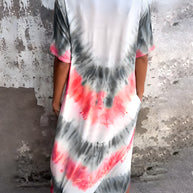 Full Size Pocketed Tie-Dye Short Sleeve Dress with vibrant colors and pockets, made from polyester and spandex.