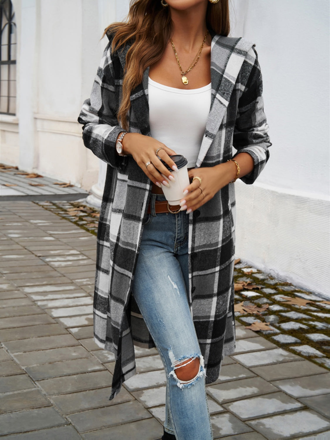 Plaid long sleeve hooded coat with buttoned and pocketed design, polyester-viscose blend.