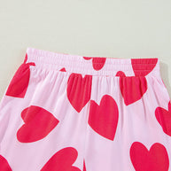 Heart patterned lounge pants with elastic waist, pink and red design.