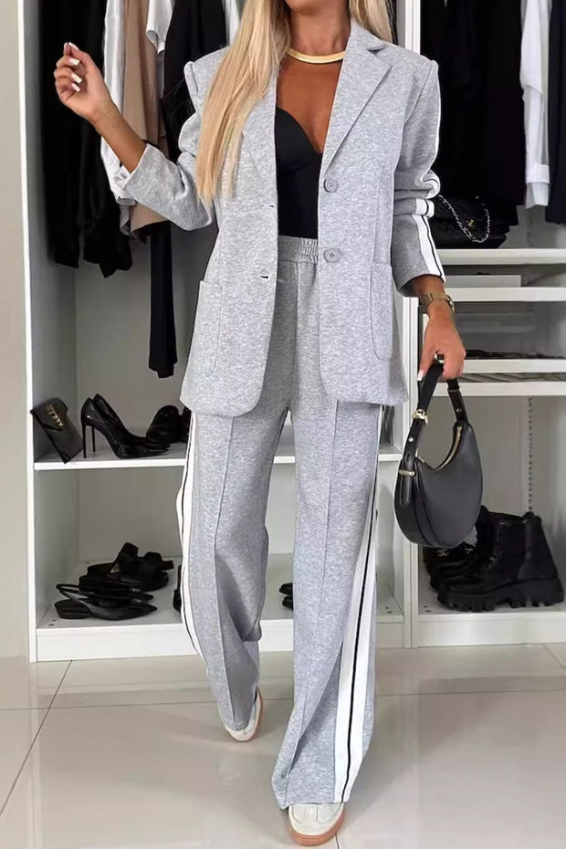 Full size contrast lapel collar top and pants set, buttoned and pocketed, in light gray.